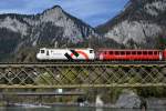 Die Ge 4/4 III 649  Lavin  zieht einen Regionalzug auf der Hinterrheinbrcke bei Reichenau am 3.4.2011.