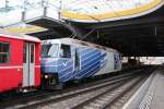 RhB Ge 4/4 III 649  Lavin  mit 20Minuten-Werbung und dem RE nach St.