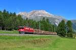 Ge 6/6 II 704 mit einem Holzzug am 03.09.2019 bei Pontresina.