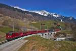 Die Ge 4/4 II 626  Malans  fährt mit einem Re aus St.Moritz nach Landquart mit dem Rhb Personenwagen WR-S 3821,der anlässlich der 39.Generalversammlung im Re 1350 eingereiht ist,in Saas