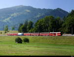 RhB - RE nach Chur / Disentis an der Spitze der Steuerwagen BDt 1753 unterwegs bei Jenaz am 30.07.2018