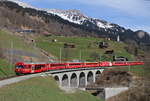 RE 1048 (Davos Platz-Landquart) mit Schublok 645 bei Saas 31.3.19