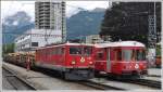 Ge 6/6 II 707  Scuol  ist mit einem Holzzug aus dem Prttigau in Landquart eingetroffen und kreuzt dort die S1 1518 nsch Schiers mit Steuerwagen 1712.