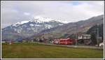 Ge 4/4 III 645  Tujetsch  und Steuerwagen 1723 zwischen Schiers und Furna mit Vilan 2376m im Hintergrund.