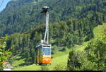 Luftseilbahn Morschach-Stoss  - Orange Kabine Nr.2 bei der ausfahrt bei der Talstation in Morschach am 08.08.2026