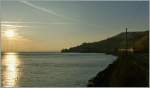 Der Tag neigt sich dem Ende zu und die Sonne dem See, als der TGV 9272 nach Paris sich dem Lac Lman entlang schlngelt. 
11. Mrz 2012