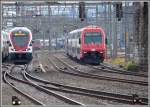 RE4916 mit 511 122 nach Schaffhausen und RE 4816 nach Aarau mit Re 450 in ürich Hardbrücke.