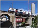 S-Bahn BR514 auf dem Wipkingerviadukt mit dem Neubau des riesigen Getreidesilos von Swissmills im Hintergrund.