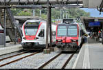 RABe 524 102 der TILO SA (SBB/TRENORD S.r.l.) als S10 von Bellinzona (CH) nach Chiasso (CH) trifft auf einen RBDe 560  Domino  als S20 von Biasca (CH) nach Locarno (CH) im Bahnhof Bellinzona (CH).
[20.9.2019 | 11:00 Uhr]