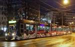 Das WLAN Free Surf Tram der BVB 303 Be6/8 Combino macht sich in seinem Schwarzen Kleid auch in der Nacht sehr gut. Am Aeschenplatz zu Basel 15. Dezember 2012 von Christian Brechbhl.