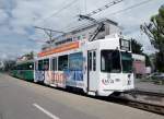 Dreiwagenzug mit dem Be 4/4 479 und der Vollwerbung fr das IWB, der B 1479S und der B 1433 an der Endhaltestelle in Pratteln.