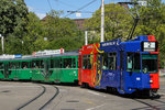 Be 4/4 490 FC Basel fährt mit zwei B4S über Kreuzung beim Hauptbahnhof.