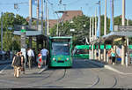 Zwei auf einen Streich:  Be 6/8 310 (Siemens Combino) der Basler Verkehrs-Betriebe (BVB) als Linie 8 von Weil am Rhein, Bahnhof/Zentrum (D), nach Basel, Neuweilerstrasse (CH), steht in der Haltestelle