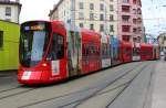 TPG STADLER TANGO 1818 mit Emirates-Werbung kurz vor der Haltestelle Gare-Cornavin.