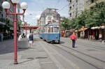 Zürich VBZ Tramlinie 10 (SWS/MFO-Be 4/4 1411, Bj. 1954) Oerlikon, Schaffhauserstrasse (Hst. Sternen Oerlikon) am 26. Juli 1993. - Wie die Personen, die in der Stadtmitte um die Bahnhofstrasse einkaufen gehen wollen, können die Züricher, die im Stadtteil Oerlikon Einkäufe machen wollen, mit den umweltfreundlichen Trams fast vor die Türen der Geschäfte kommen - schnell, effektiv, ohne die Umwelt zu belasten! - Scan eines Farbnegativs. Film: Kodak Gold 200-3. Kamera: Minolta XG-1.