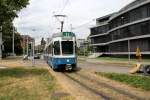 Zürich VBZ Tram 11 (SWP/SIG/BBC Be 4/6 2054) Bellerivestrasse / Tiefenbrunnen am 13. Juli 2015. - Zwischen dem 11. Juli und 14. August 2015 ist die Tramlinie 11 wegen Bauarbeiten am Bellevue und an der Quaibrücke geteilt: Der eine Teil fährt auf der Strecke Rehalp - Bhf. Stadelhofen / Opernhaus - Bhf. Tiefenbrunnen, der andere zwischen Auzelg und Bhf. Enge.