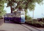 Zürich VBZ Tram 4 (SWS/BBC Be 4/4 1550) Tiefenbrunnen am 14. Juli 1983. - Scan von einem Farbnegativ.