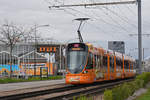 Be 6/10 Tango 182 mit der Werbung für 20 Jahre OBI in Basel, auf der Linie 11, fährt am Jubilierenden Geschäft vorbei zur Haltestelle M-Parc.