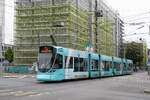 Be 6/10 Tango 164 mit der Medicar AG Werbung für Personen und Patienten Transport, auf der Linie 11, verlässt am 04.05.2026 die Haltestelle Voltaplatz. Aufnahme Basel.