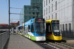 Am 29.12.2025 bedienen der Be 6/10 Tango 187 mit der Migros Werbung, auf der Linie 11 und der Be 8/10 TINA 4218, auf der Linie 10, die Haltestelle Peter Merian. Aufnahme Basel.