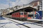 Die SBB Re 6/6 11607 (Re 620 007-5) mit einem Güterzug Richtung Villeneuve bei der Durchfahrt in Montreux.