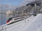 Zwei SBB RABe 503 als EC 34 von Milano nach Genève vor der verschneiten Kulisse des Château de Chillon.