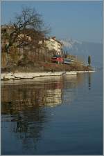 Eine Re 460 mit ihrem IR Brig - GenveAroport bei St-Saphorin.
14.03.2012