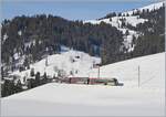 Ein bunter GoldenPass  Lenker -Pendel Be 4/4 Serie 5000 ist bei Schönried auf der Fahrt in Richtung Gstaad. 

26. Februar 2019