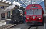 Dampfextrazug 2056 nach Landquart mit G 4/5 107  Albula  und RE1056 nach Landquart mit Steuerwagen 1754 in Davos Platz.