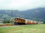 RhB Salon-Extrazug fr RHTIA TOURS 3032 von Davos-Platz nach Landquart vom 01.09.1996 zwischen Malans und Landquart mit E-Lok Ge 4/6 353 - AS 1144 - AS 1141 - AS 1143 - D 4052I. Hinweis: selten wurde auf dem RhB-Netz bei den Salonwagen vor der Modernisierung ein grner Gepckwagen mitgefhrt, war aber bei dieser Fahrt ntig, da die Reiseteilnehmer ber 200 Koffer und Reisetachen mitfhrten! Bemerkenswert ist, da die Lok mit beiden gehobenen Pantografen unterwegs ist!