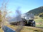 RhB Salon-Dampfzug 3153 fr GRAUBNDEN TOURS von Davos-Platz nach Filisur vom 25.10.1997 in Davos-Islen mit Dampflok-Doppelbespannung G 4/5 107 - G 4/5 108 - As 1144 - As 1142 - As 1141 - As 1143 - As 1161. Hinweis: Hier zwischen Davos Platz und Islen gibt es mehrere hniche Motive zu schieen, es fhrt ein Spazierweg den Flu entlang, gute Sonne ab 15:30h bei Sommerzeit. An gleicher km-Stelle jedoch von anderer Seite aufgenommen siehe nachfolgendes Foto. 