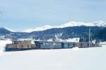 RhB Extra-GmP 3031 fr GRAUBNDENTOURS AG von Landquart nach Davos Platz am 14.03.1999 kurz vor Davos Dorf mit E-Lok Ge 6/6 I 414 - B 2246 - D 4052II - Gbkv 5568 - Gbkv 5593 - Gb 5082 - E 6610 - Kk 7070.
