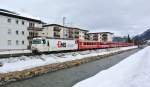 Ge 4/4 III 643  EMS-Chemie  erreicht mit dem stark verlngertem RE 1037 in Krze Davos Platz, 09.03.2013.