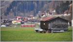 ABe 4/16 3101 auf einer Überfuhr nach Davos bei Schiers. Typisch für das Prättigau sind die verstreuten Holzställe. (28.11.2013)