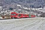 RE1036 von Davos nach Landquart mit führendem Steuerwagen 1754 und mittiger Lok Ge 4/4 IIi 647  Grüsch  zwischen Malans und Landquart. (04.01.2017)