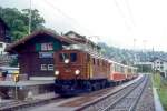 RhB Salonzug fr RHTIA TOURS 3032 von Davos Platz nach Landquart am 01.09.1996 in Klosters Dorf mit E-Lok Ge 4/6 353 - AS 1144 - AS 1141 - AS 1143 - D 4052I. Hinweis: sehr trbes Regenwetter, Salonwagen inzwischen alle umgebaut.
