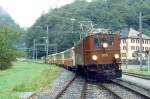 RhB Salonzug fr RHTIA TOURS 3032 von Davos Platz nach Landquart am 01.09.1996 in Fideris Dorf mit E-Lok Ge 4/6 353 - AS 1144 - AS 1141 - AS 1143 - D 4052I. Hinweis: sehr trbes Regenwetter, Salonwagen inzwischen alle umgebaut.
