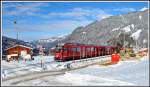 RE 1033 mit ABe 8/12 3515 zwischen Klosters Dorf und Klosters Platz, wo trotz Kälte und Schnee an der Doppelspur gebaut wird.