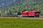 Ge 6/6 II 703  St.Moritz  fährt mit einem Güterzug nach Davos Platz mit der kalten Gem 4/4 801 in Schiers vorüber.Bild 24,6,2016