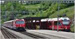 IR1149 nach St.Moritz mit Ge 4/4 III 647  Grüsch  neben R1840 nach davos Platz mit ABe 8/12 3514 in Filisur.