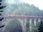 RhB Heidiland-Bernina-Expre G 503 von Landquart ber Davos-Platz - Filisur - Pontresina nach Tirano vom 30.08.1996 auf Wiesener Viadukt mit Ge 4/4III - AB 1565 - AB 1568 - AB 1567 - D 4210 - B 2468 -