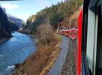 RhB_Chur-Disentis(-Oberalppass)__Strecke entlang dem Vorderrhein hinter Tamins-Reichenau (wo Vorder- und Hinterrhein sich zum Rhein vereinigen) nach Disentis.__25-02-2024