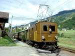 RhB Extrazug fr GRAUBNDEN TOURS 3238 von Disentis nach Landquart vom 30.08.1997 in Tavanasa mit E-Lok-Oldtimer Ge 2/4 222 - B 2247 - B 2246 - D 4052I. Hinweis: mit Blick auf Kirche von Tavanasa.