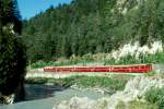 RhB REGIONALZUG 241 von Chur nach Disentis am 01.09.1997 bei der Hochwassermarke zwischen Reichenau und Trin mit E-Lok Ge 4/4I 603 - B 2348 - B 2334 - B 2351 - A 1241 - D 4213.