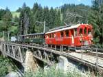 RhB Extra-GmP 3641 von Chur nach Arosa am 31.08.1997 auf Frauentabel-Viadukt mit Bernina-Triebwagen ABe 4/4I 32 - B 2247 - D 4052II - Xk 9398.