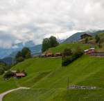 ABe 8/12 3507  Benedetg Fontana  am 9. August 2011 mit dem R 1441 (Chur - Arosa) bei Langwies. Wie bei fast allen Zgen auf der Arosabahn werden am Zugschluss mehrere Gterwagen mitgefhrt.