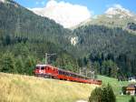 RhB Schnellzug BERNINA-EXPRESS D 500 von Tirano nach Chur am 06.09.1994 bei Naz kurz unterhalb Preda mit E-Lok Ge 4/4II 627 und EW-IV-Kompo.