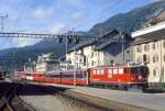 RhB Schnellzug GLACIER-EXPRESS H 2903 von St.Moritz nach Zermatt am 11.09.1994 Einfahrt Samedan mit E-Lok Ge 6/6II 706 - WR 3816/3817 - A 1266 - FO AS 4030 - FO B 4272 - BVZ B 2284 - FO A 4065 - B