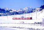 RhB Schnellzug 521 von Chur nach St.Moritz am 01.02.1998 kurz vor Celerina mit E-Lok Ge 4/4III 648 - D - B - B - B - A - A.