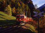 Ge 4/4 I 609 erreicht mit dem  Heidi-Express  Tirano - Davos im letzten Abendlicht in Krze Filisur, 15.10.2005 (Scan vom Dia)